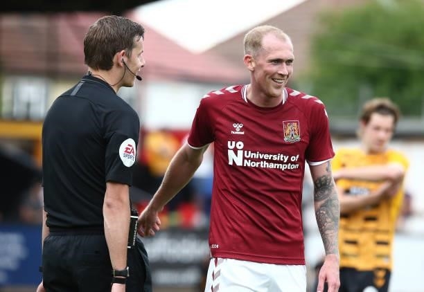 Referee Alan Dale with Mitch Pinnock of Northampton Town during the Pre Season Friendly match between Cambridge United and Northampton Town at Abbey...