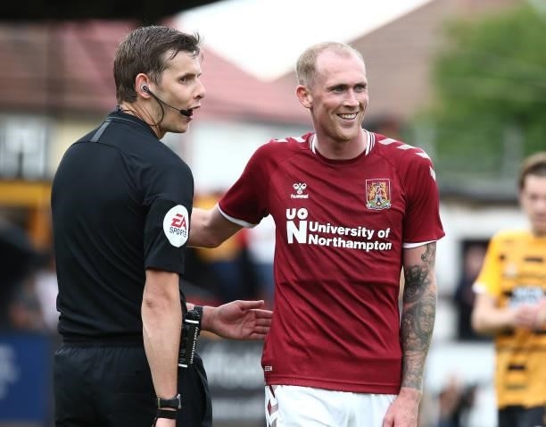 Referee Alan Dale with Mitch Pinnock of Northampton Town during the Pre Season Friendly match between Cambridge United and Northampton Town at Abbey...