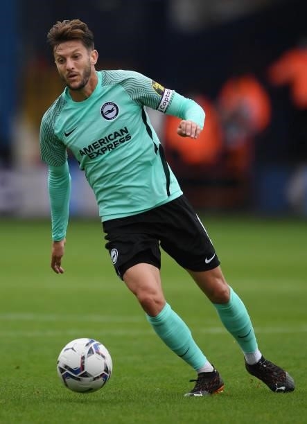 Adam Lallana of Brighton and Hove Albion runs with the ball during the Pre-Season Friendly match between Luton Town and Brighton & Hove Albion at...