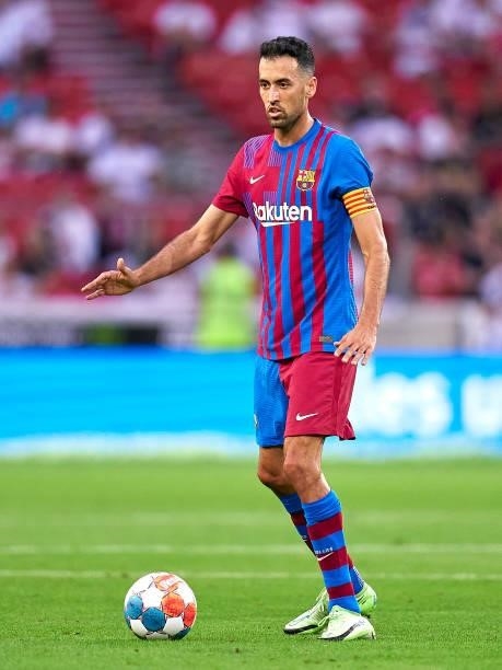 Sergio Busquets of FC Barcelona with the ball during a pre-season friendly match between VfB Stuttgart and FC Barcelona at Mercedes-Benz Arena on...
