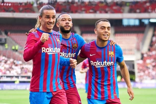 Players of FC Barcelona celebrating their team's second goal during a pre-season friendly match between VfB Stuttgart and FC Barcelona at...
