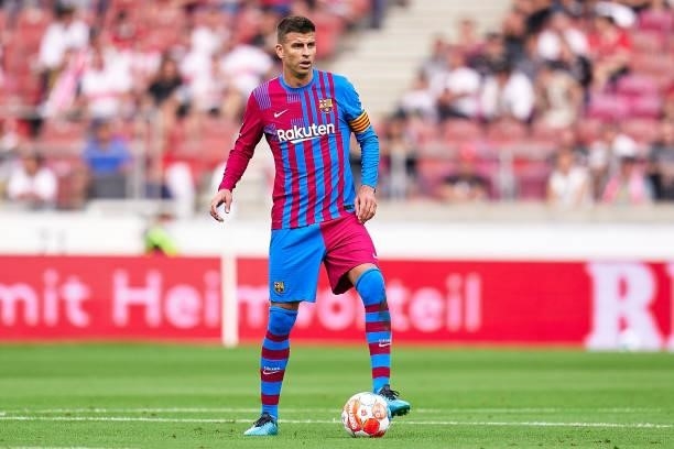 Gerard Pique of FC Barcelona with the ball during a pre-season friendly match between VfB Stuttgart and FC Barcelona at Mercedes-Benz Arena on July...