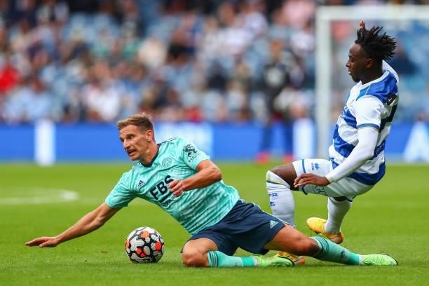 Moses Odubajo of Queens Park Rangers tackles Marc Albrighton of Leicester City during the Pre-Season Friendly match between Queens Park Rangers and...