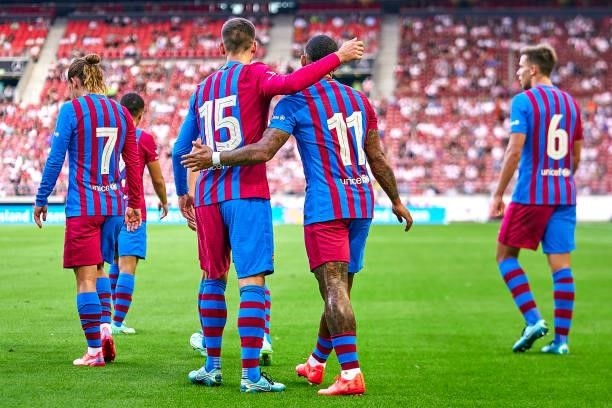 Players of FC Barcelona celebrating their team's first goal during a pre-season friendly match between VfB Stuttgart and FC Barcelona at...