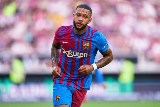 Memphis Depay of FC Barcelona celebrates his team's opening goal during a pre-season friendly match between VfB Stuttgart and FC Barcelona at...