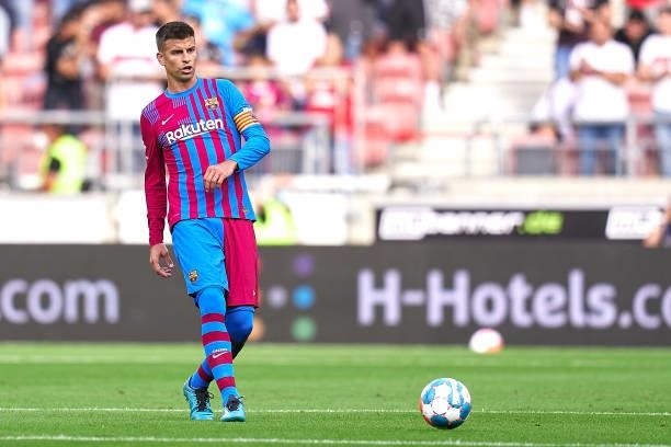 Gerard Pique of FC Barcelona with the ball during a pre-season friendly match between VfB Stuttgart and FC Barcelona at Mercedes-Benz Arena on July...