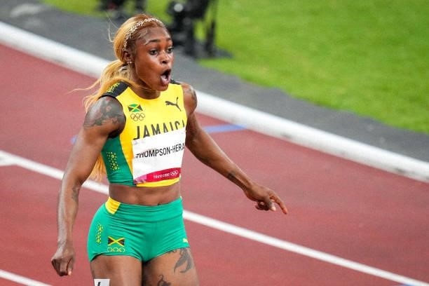 Elaine Thompson-Herah of Team Jamaica celebrates after winning the gold medal while competing on Women's 100m Final during the Tokyo 2020 Olympic...