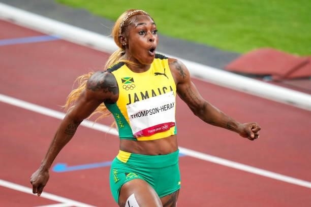 Elaine Thompson-Herah of Team Jamaica celebrates after winning the gold medal while competing on Women's 100m Final during the Tokyo 2020 Olympic...