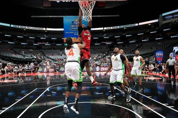 Amir Johnson of the Trilogy dunks the ball past Brandon Rush of the Aliens during BIG3 - Week Four at the American Airlines Center on July 31, 2021...