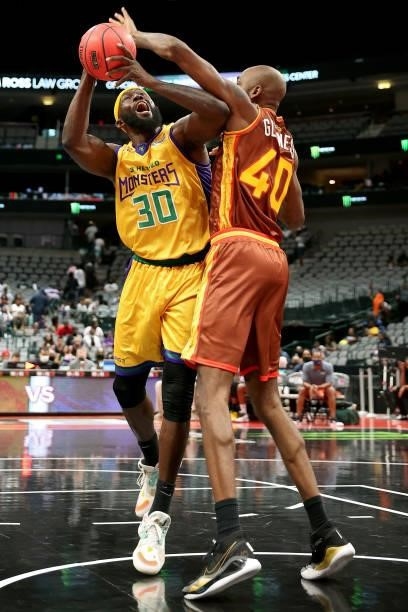 Reggie Evans of the 3 Headed Monsters attempts a shot while being guarded by Mickell Gladness of the Bivouac during BIG3 - Week Four at the American...