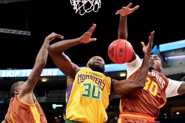Reggie Evans of the 3 Headed Monsters attempts a shot while being guarded by Cory Jefferson and Quincy Miller of the Bivouac during BIG3 - Week Four...