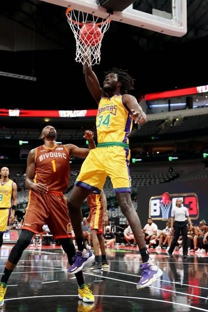 Mamadou N'Diaye of the 3 Headed Monsters dunks the ball past Cory Jefferson of the Bivouac during BIG3 - Week Four at the American Airlines Center on...