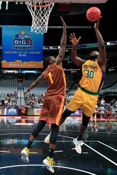 Reggie Evans of the 3 Headed Monsters attempts a shot while being guarded by Cory Jefferson of the Bivouac during BIG3 - Week Four at the American...