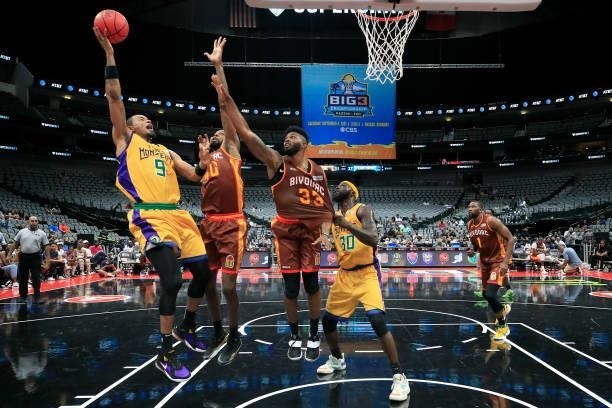 Rashard Lewis of the 3 Headed Monsters attempts a shot while being guarded by Mickell Gladness and Alonzo Gee of the Bivouac during BIG3 - Week Four...