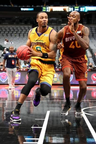 Rashard Lewis of the 3 Headed Monsters dribbles the ball while being guarded by Mickell Gladness of the Bivouac during BIG3 - Week Four at the...