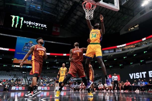 Mamadou N'Diaye of the 3 Headed Monsters dunks the ball past Cory Jefferson of the Bivouac during BIG3 - Week Four at the American Airlines Center on...