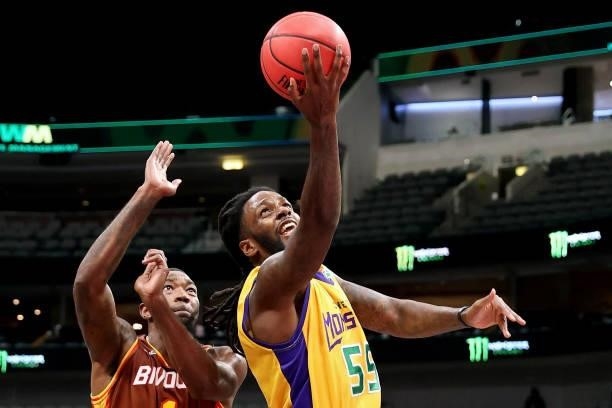 Kevin Murphy of the 3 Headed Monsters attempts a layup while being guarded by Cory Jefferson of the Bivouac during BIG3 - Week Four at the American...