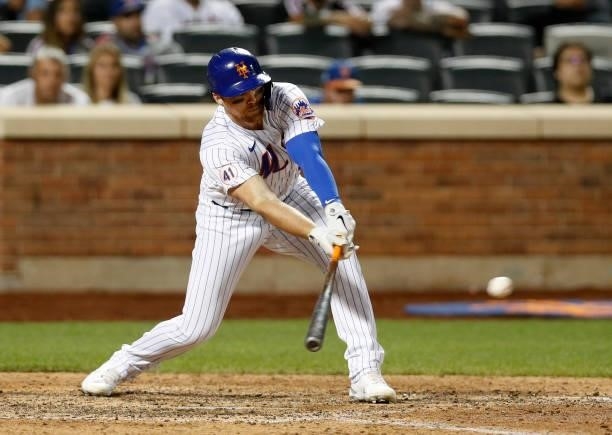 Brandon Drury of the New York Mets connects on his tenth inning game winning base hit against the Cincinnati Reds at Citi Field on July 31, 2021 in...