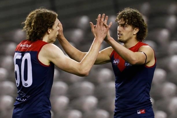 Luke Jackson of the Demons celebrates a goal with Ben Brown of the Demons during the round 20 AFL match between Gold Coast Suns and Melbourne Demons...