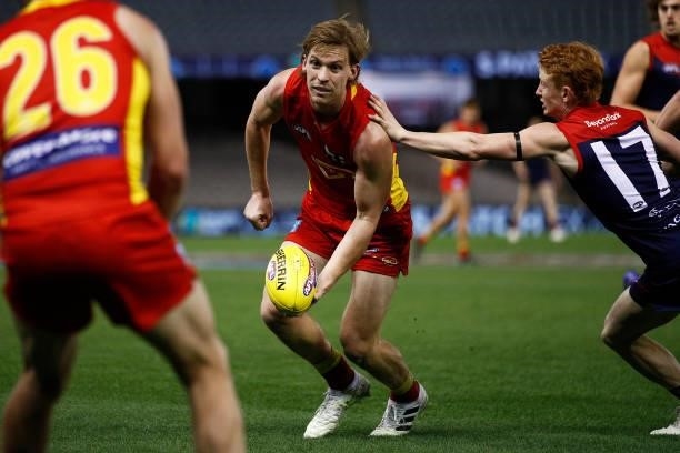 Noah Anderson of the Suns handballs during the round 20 AFL match between Gold Coast Suns and Melbourne Demons at Marvel Stadium on August 01, 2021...