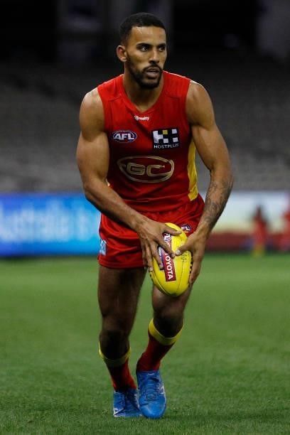 Touk Miller of the Suns looks to pass the ball during the round 20 AFL match between Gold Coast Suns and Melbourne Demons at Marvel Stadium on August...