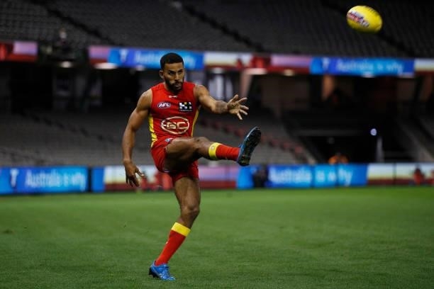 Touk Miller of the Suns kicks the ball during the round 20 AFL match between Gold Coast Suns and Melbourne Demons at Marvel Stadium on August 01,...
