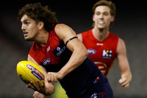 Luke Jackson of the Demons handballs during the round 20 AFL match between Gold Coast Suns and Melbourne Demons at Marvel Stadium on August 01, 2021...