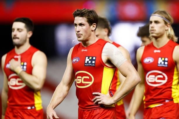 David Swallow of the Suns looks dejected as the Suns leave the field after the round 20 AFL match between Gold Coast Suns and Melbourne Demons at...