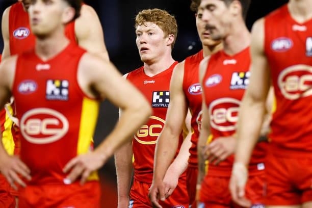 Matt Rowell of the Suns looks dejected as the Suns leave the field after the round 20 AFL match between Gold Coast Suns and Melbourne Demons at...