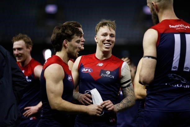 James Harmes of the Demons celebrates victory with teammates after the round 20 AFL match between Gold Coast Suns and Melbourne Demons at Marvel...