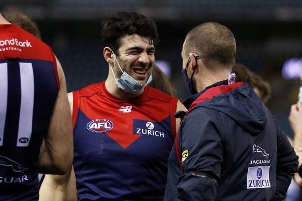 Christian Petracca of the Demons celebrates victory with Demons head coach Simon Goodwin after the round 20 AFL match between Gold Coast Suns and...