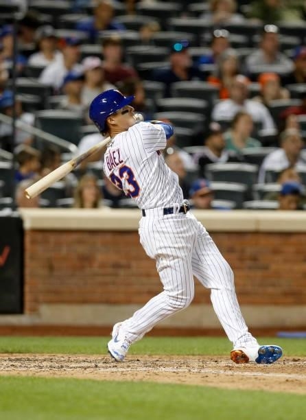 Javier Baez of the New York Mets follows through on his sixth inning two run home run against the Cincinnati Reds at Citi Field on July 31, 2021 in...