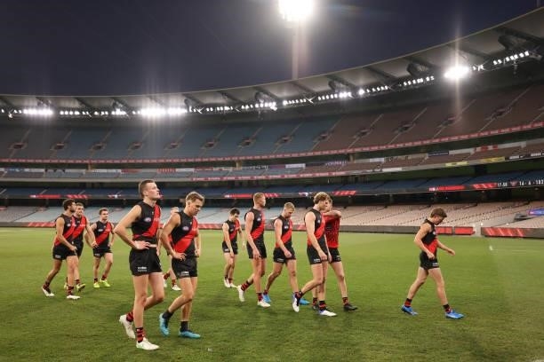 Essendon players leave the ground after their loss during the round 20 AFL match between Essendon Bombers and Sydney Swans at Melbourne Cricket...