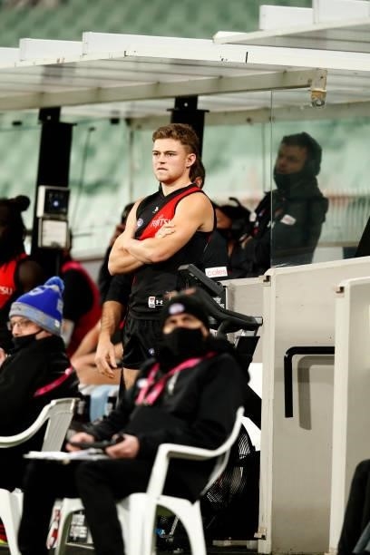 Essendon medical sub Brayden Ham looks on from the bench as Essendon tries to get him on the ground in the final minutes during the round 20 AFL...