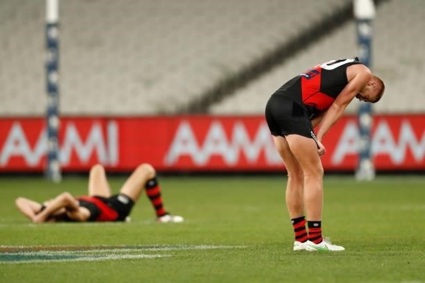 Dejected Essendon players are seen after the round 20 AFL match between Essendon Bombers and Sydney Swans at Melbourne Cricket Ground on August 01,...