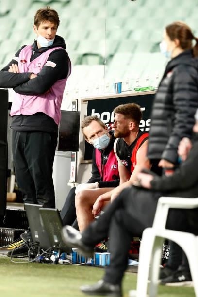 Jayden Laverde of Bombers sits on the bench during the round 20 AFL match between Essendon Bombers and Sydney Swans at Melbourne Cricket Ground on...