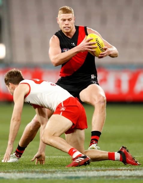 Peter Wright of the Bombers runs with the ball during the round 20 AFL match between Essendon Bombers and Sydney Swans at Melbourne Cricket Ground on...