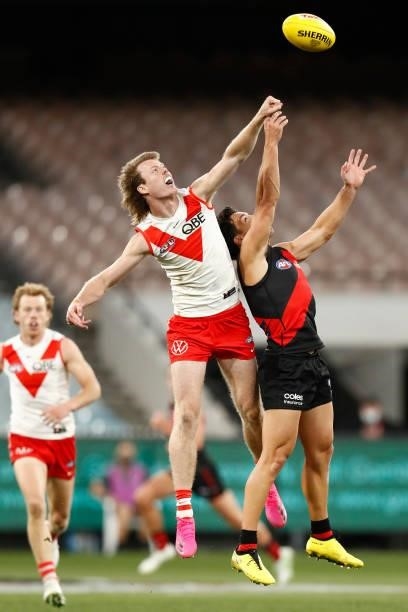 Nick Blakey of the Swans spoils Dylan Shiel of the Bombers during the round 20 AFL match between Essendon Bombers and Sydney Swans at Melbourne...