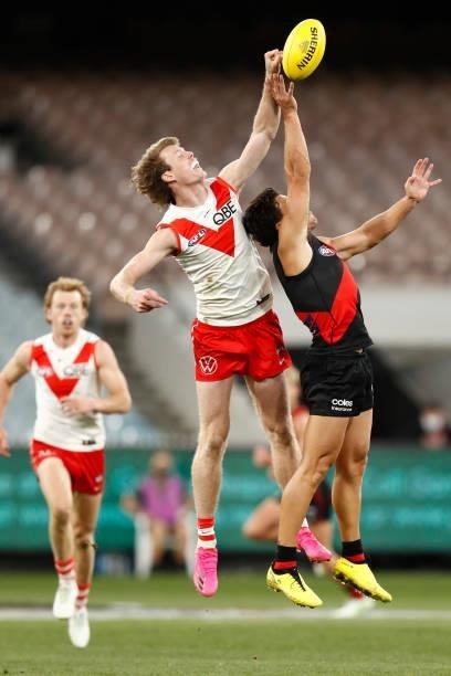 Nick Blakey of the Swans spoils Dylan Shiel of the Bombers during the round 20 AFL match between Essendon Bombers and Sydney Swans at Melbourne...