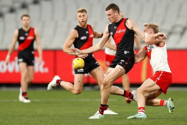 Nikolas Cox of the Bombers kicks the ball during the round 20 AFL match between Essendon Bombers and Sydney Swans at Melbourne Cricket Ground on...