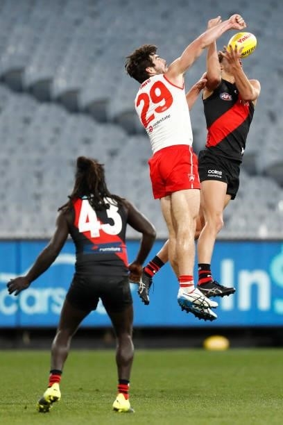 George Hewett of the Swans spoils Archie Perkins of the Bombers during the round 20 AFL match between Essendon Bombers and Sydney Swans at Melbourne...