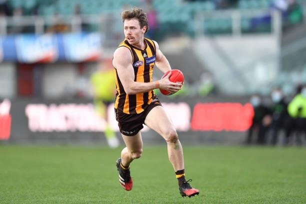 Lachlan Bramble of the Hawks runs the ball during the round 19 AFL match between Hawthorn Hawks and Brisbane Lions at University of Tasmania Stadium...