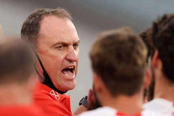 Sydney Coach John Longmire addresses his team during the round 20 AFL match between Essendon Bombers and Sydney Swans at Melbourne Cricket Ground on...