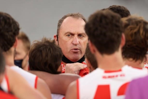 Sydney Coach John Longmire addresses his team during the round 20 AFL match between Essendon Bombers and Sydney Swans at Melbourne Cricket Ground on...
