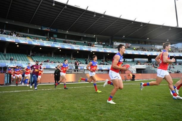 Brisbane Lions take the field during the round 19 AFL match between Hawthorn Hawks and Brisbane Lions at University of Tasmania Stadium on August 01,...