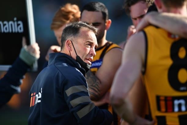 Alastair Clarkson Head Coach of the Hawks addresses the players during the round 19 AFL match between Hawthorn Hawks and Brisbane Lions at University...