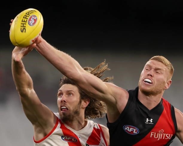 Tom Hickey of the Swans and Peter Wright of the Bombers contest for the ruck during the round 20 AFL match between Essendon Bombers and Sydney Swans...
