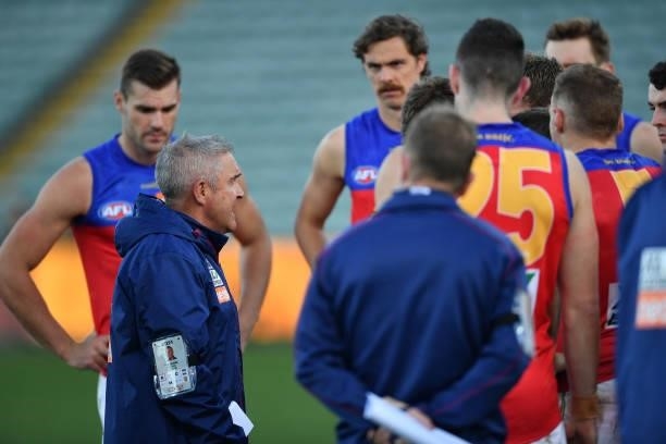Chris Fagan, Senior Coach of the Lions addresses the players during the round 19 AFL match between Hawthorn Hawks and Brisbane Lions at University of...