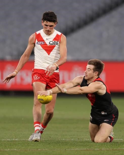 Zach Merrett of the Bombers with a smother during the round 20 AFL match between Essendon Bombers and Sydney Swans at Melbourne Cricket Ground on...