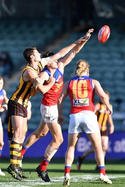 Ned Reeves of the Hawks and Oscar McInerney of the Lions compete in a ruck contest during the round 19 AFL match between Hawthorn Hawks and Brisbane...